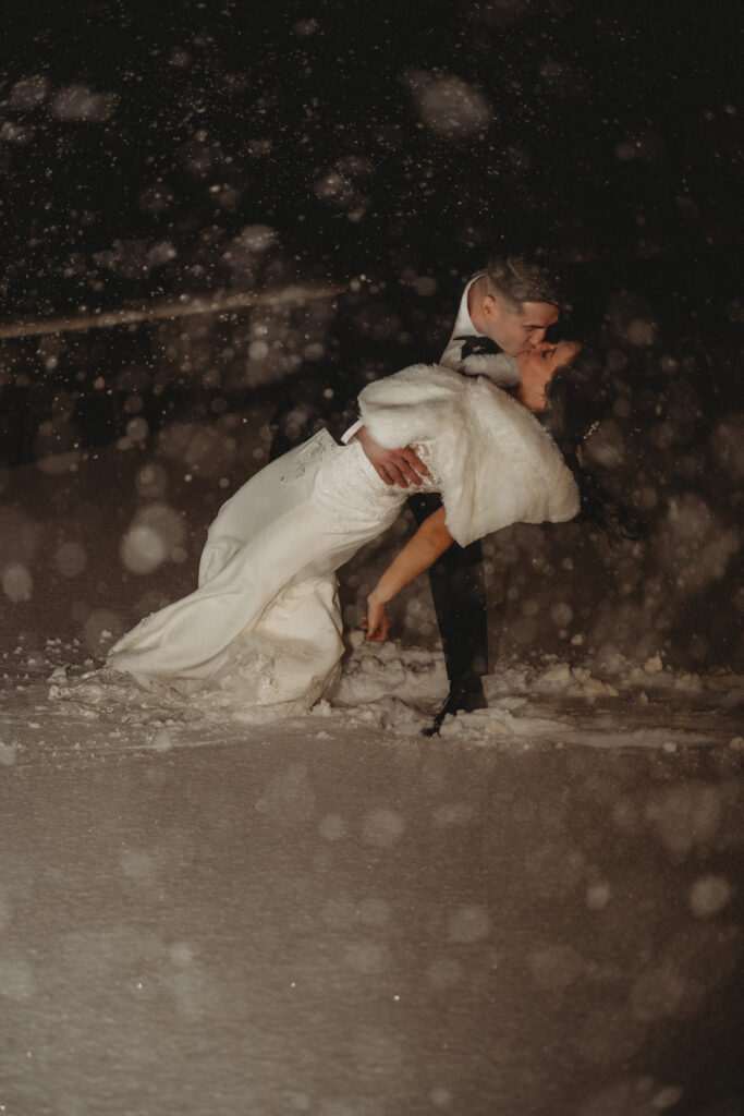 Wedding ceremony at Tyde at Walnut Beach in Milford Connecticut during evening snowstorm