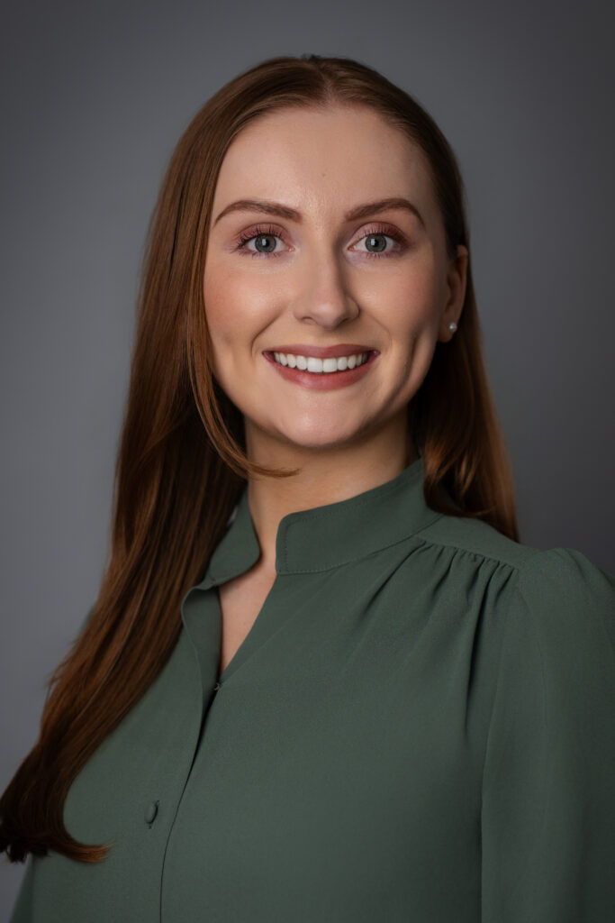 A versatile studio headshot of Caroline that feels true to who she is, perfect for speaking engagements and professional platforms.